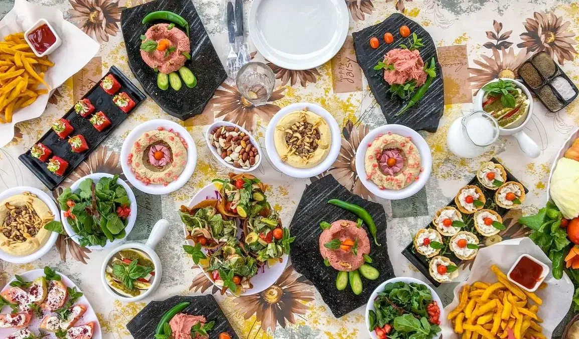Photo of a shared table with many dishes